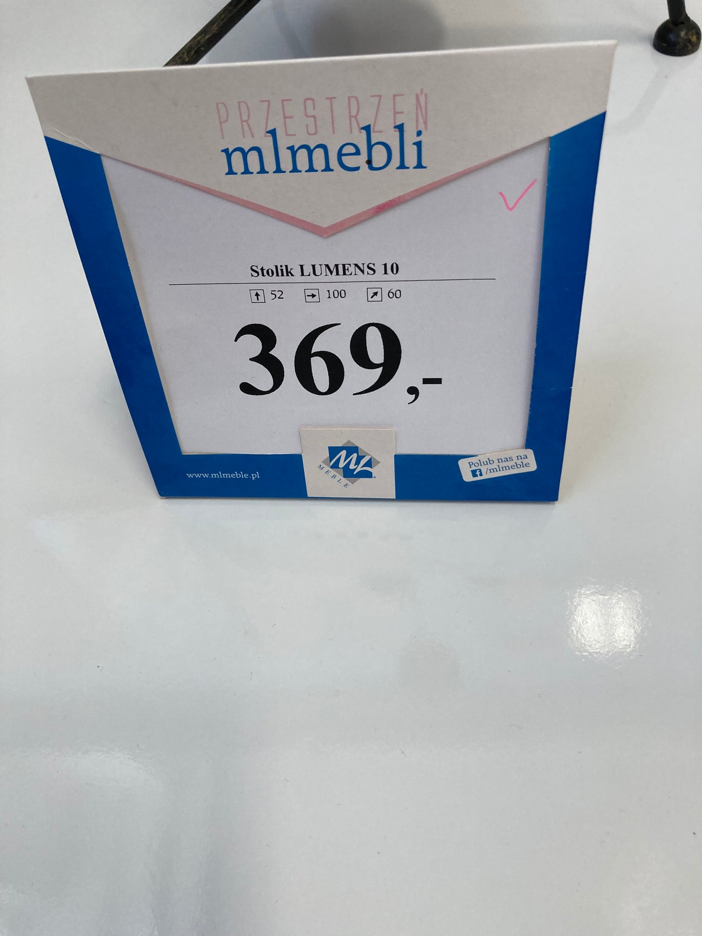 Cena przed wyprzedażą, wymiary mebla oraz zbliżenie ukazujące biały blat w lekkim połysku.