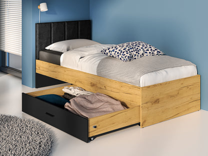 Zdjęcie przedstawiające nowoczesne łóżko KOLT z szufladą oraz welurowym zagłówkiem. Młodzieżowe łóżko KOLT 90x200 dostępne w niskiej cenie na dmsm.pl