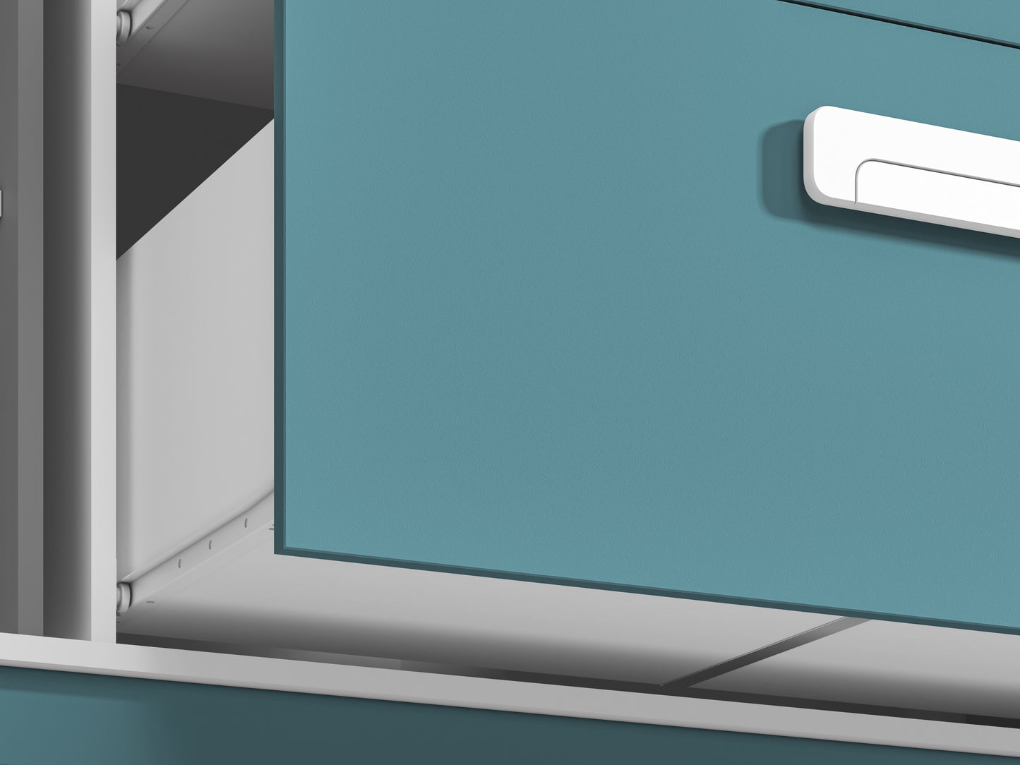 Zbliżenie na front szafki komody MICK, prowadnicę zastosowaną w szufladzie oraz część oryginalnego uchwytu. 