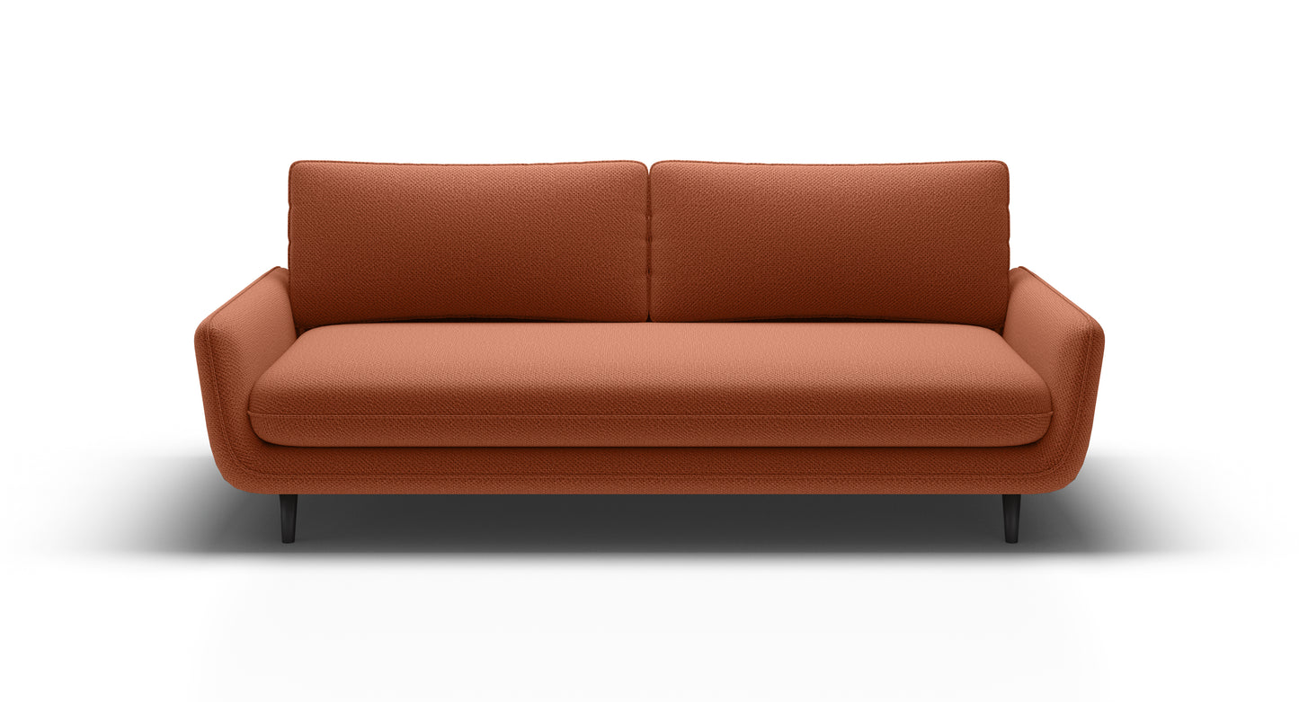 Zbliżenie na kanapę sofę rozkładaną SOLANO  ukazujące jej nietuzinkowy kształt, estetyczne wykonanie, ozdobne przeszycia i inne detale, które zdobią mebel.