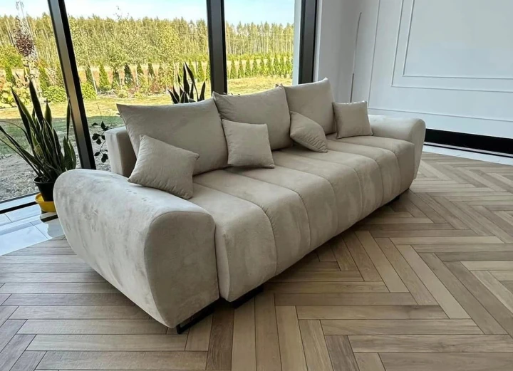 Na zdjęciu jest przedstawiony nowoczesna sofa do salonu która posiada funkcję oraz obszerny pojemnik na pościel Ragnar 3