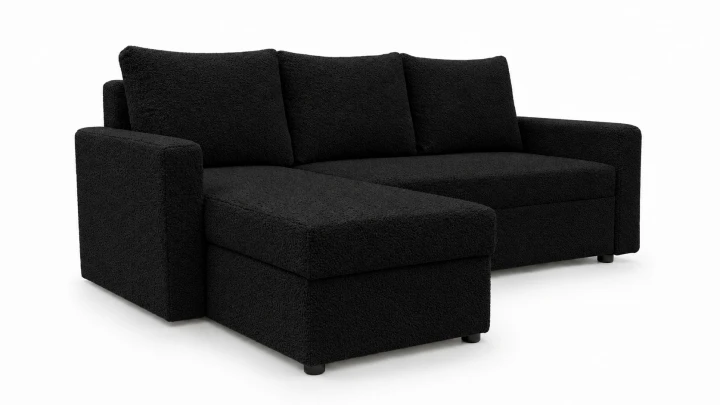 Zdjęcie przedstawiające lewostronny narożnik rozkładany do salonu Teddy wykonany w czarnej tkaninie boucle