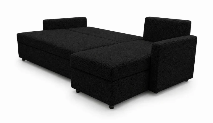 Zdjęcie przedstawiające dużą powierzchnię spania w nowoczesnym narożniku rozkładanym do salonu Teddy w czarnej tkaninie boucle
