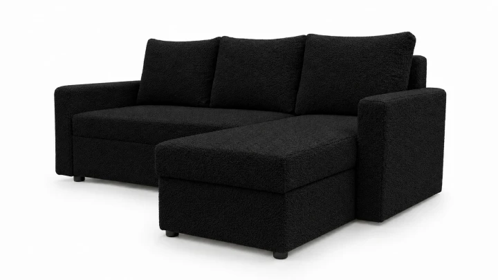 Zdjęcie przedstawiające prawostronny narożnik rozkładany do salonu Teddy wykonany w czarnej tkaninie boucle
