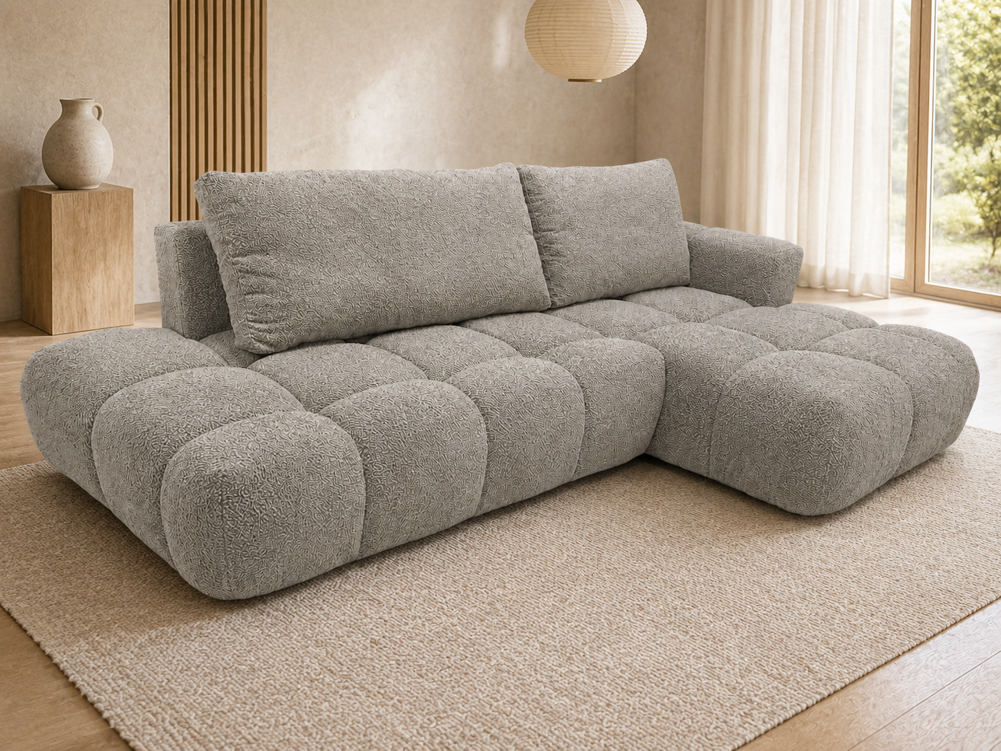 Zdjęcie przedstawiające nowoczesny narożnik rozkładany z funkcją spania Soffi w beżowej tkaninie boucle na białym tle
